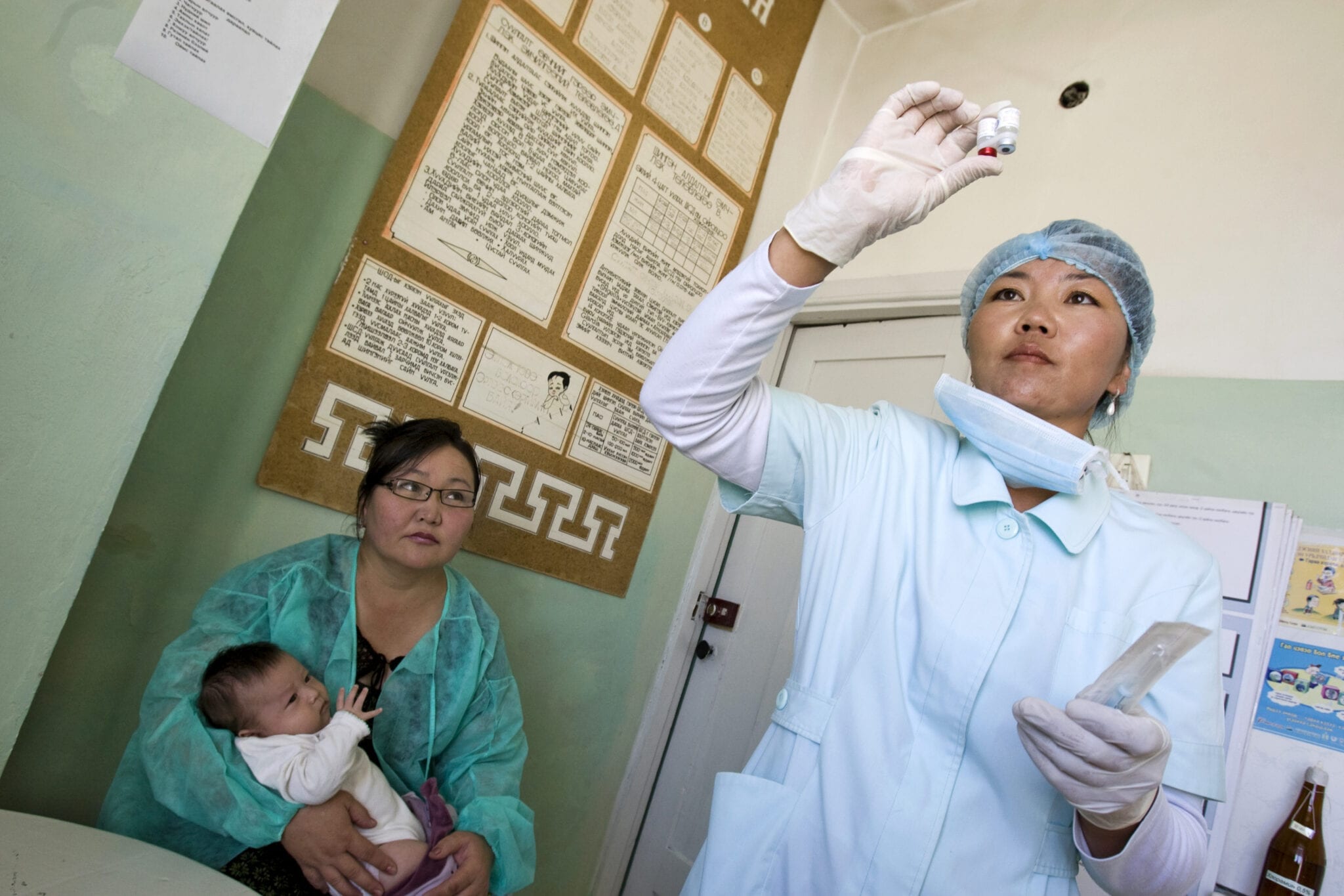 Physician with patient and baby at family clinic COVID-19 and the Reproductive Health and Rights Landscape in Asia