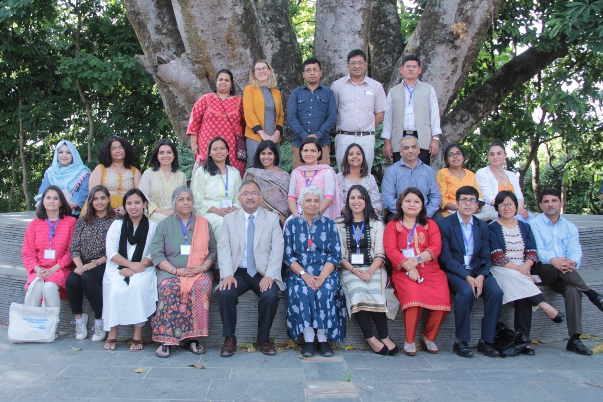 SARJAI Advisory Committee members seated together outside South Asia Reproductive Justice and Accountability Initiative (SARJAI)