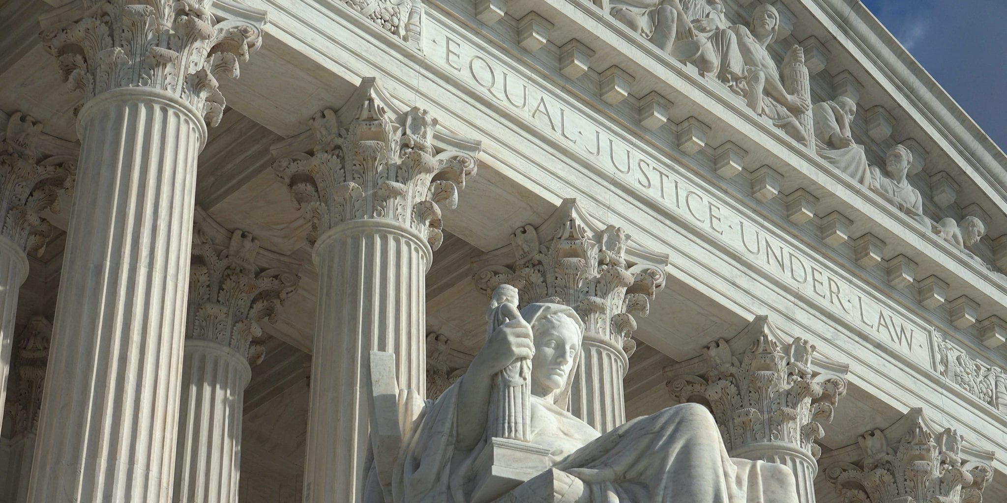 Closeup view of the United States Supreme Court exterior, with the words, "Equal justice under law" visible