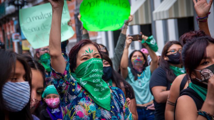 Women in Puebla, Mexico, with green scarves, demanding legalization of abortion.