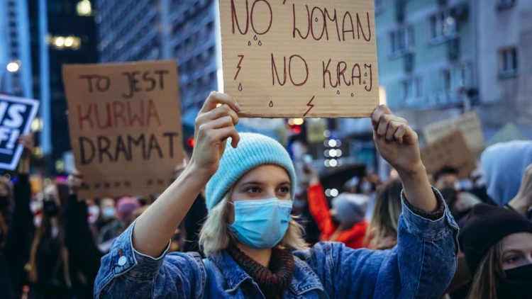 Woman in Poland with sign for abortion rights