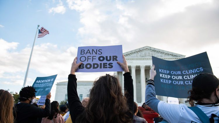 Supreme court bans off our bodies rally sign