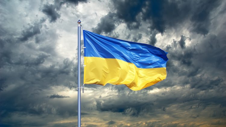 Ukranian flag against a cloudy sky