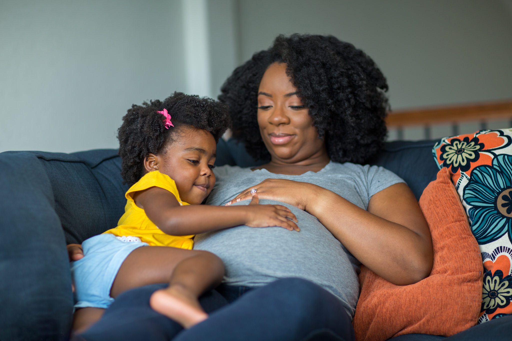 Pregnant black woman with daughter U.S. Maternal Health and Rights Initiative