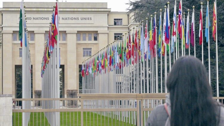 Center client Fausia facing the United Nations HQ building in Geneva.