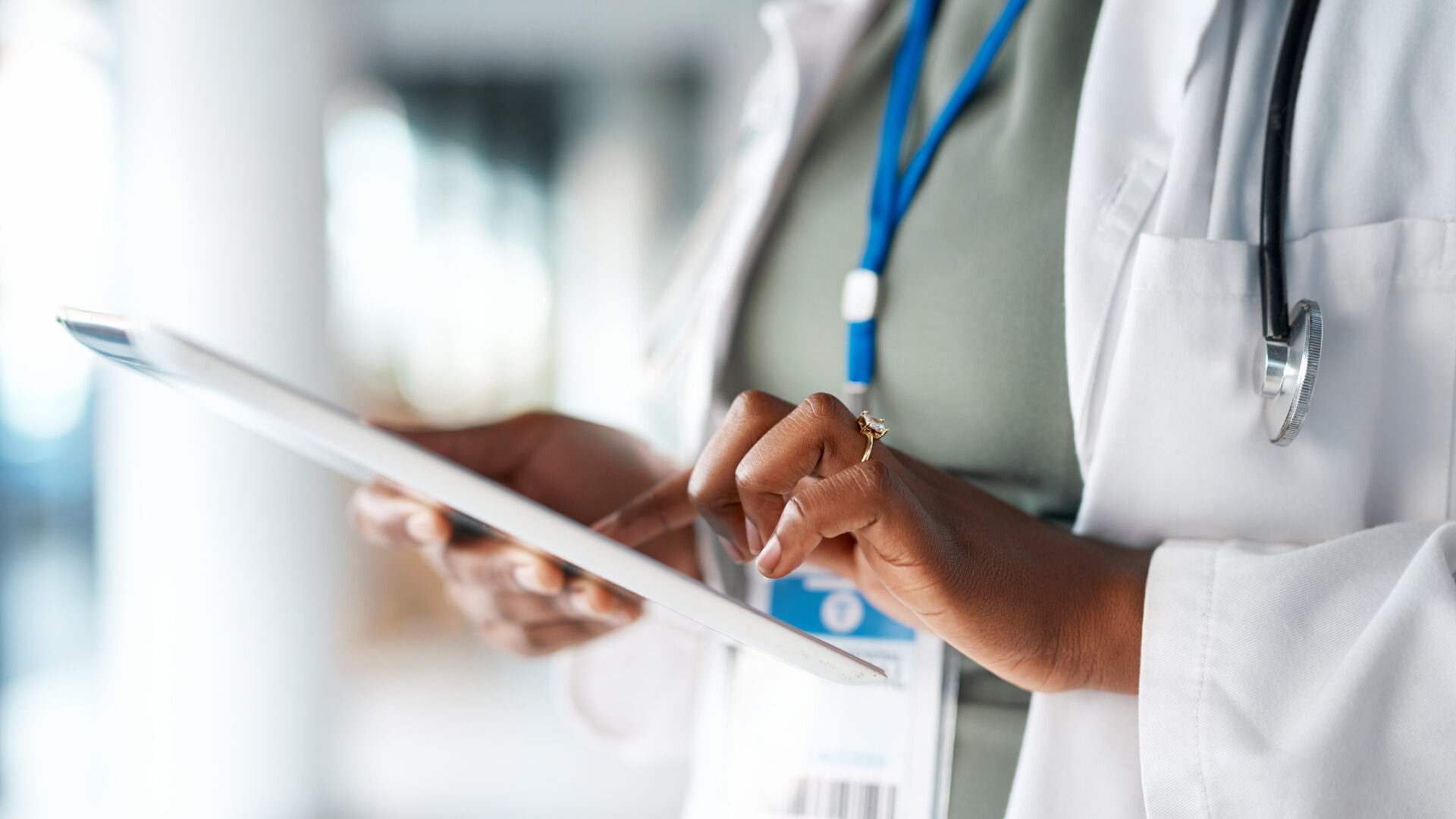 Doctor holding tablet in a hospital setting
