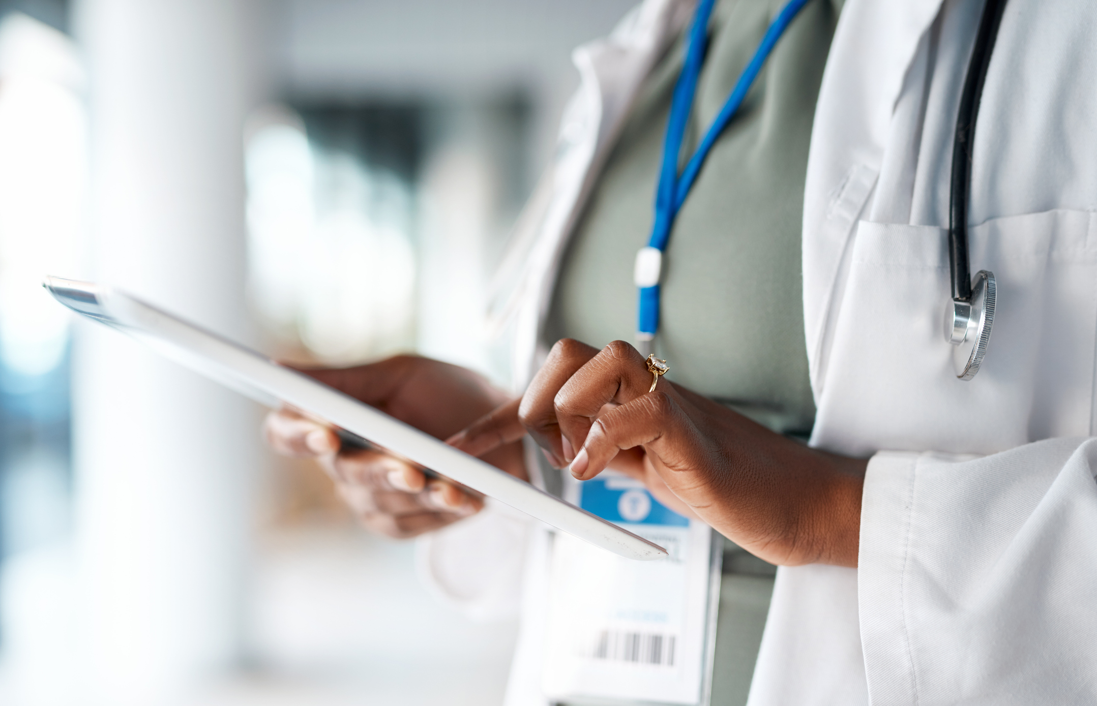 Doctor holding tablet in a hospital setting