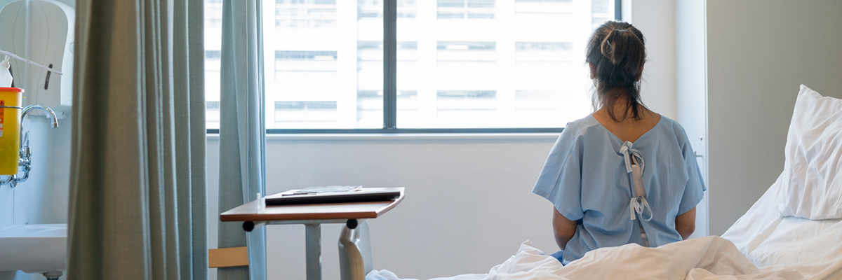 woman sitting on a hospital bed