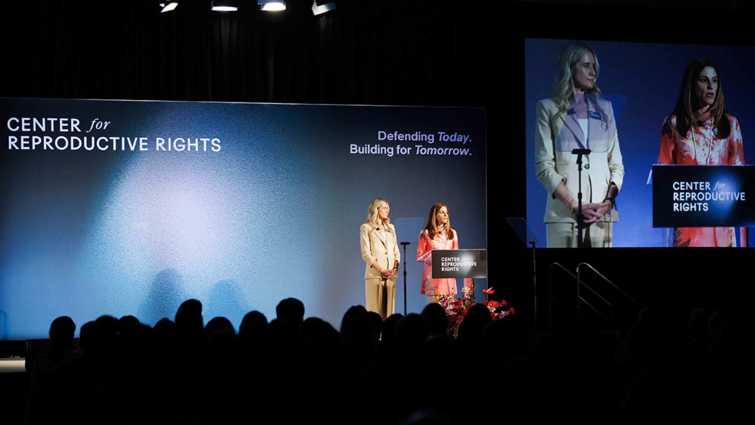 San Francisco Benefit 2026 - two speakers on a stage