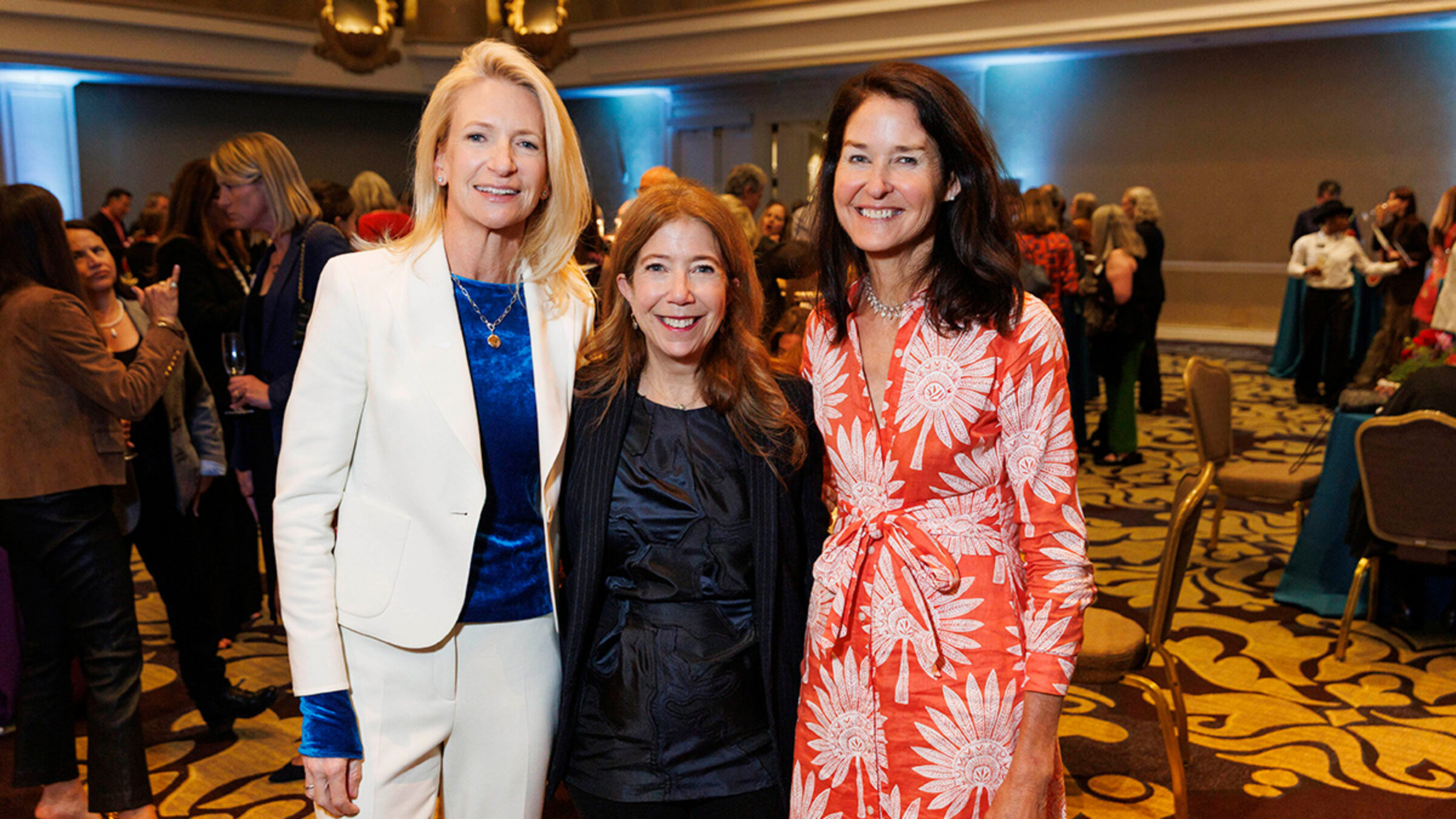 San Francisco Benefit 2026 - three women posing for a photo in a crowd