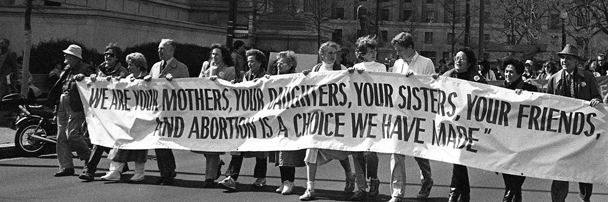 people marching in the 1970s for reproductive rights