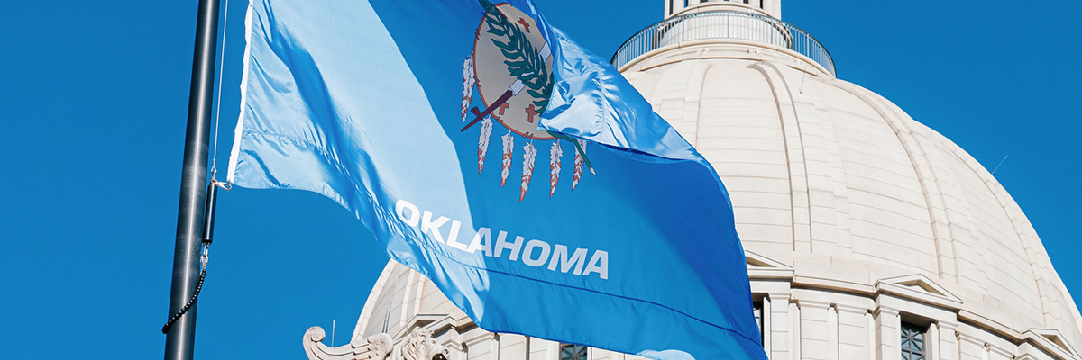 Oklahoma flag in front of capital building